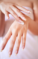 Hand, woman and cream for skincare at house for skin nutrition, beauty and cosmetics with treatment for healthy body. Person, product and hygiene for clean, glow and shine from dermatology in morning