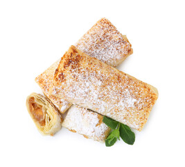 Tasty apple strudels with powdered sugar and mint isolated on white, top view
