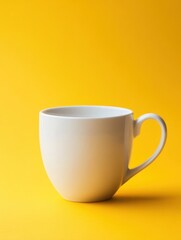 A simple white coffee mug against a bright yellow background, perfect for showcasing beverage products, branding, or minimalist designs in advertising, social media, or websites,