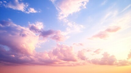 Obraz premium Soothing sunset sky with pastel pink and blue hues, scattered clouds creating a serene atmosphere.