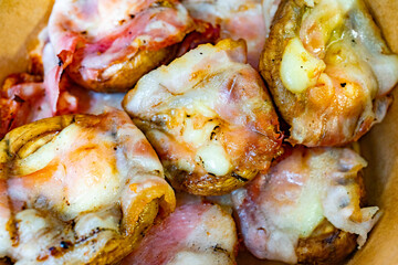 Deliciously cooked mushrooms topped with cheese and bacon