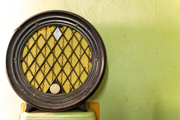 Vintage radio showcasing classic design with yellow mesh detail