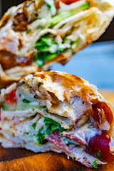Delicious grilled wrap filled with chicken and fresh vegetables