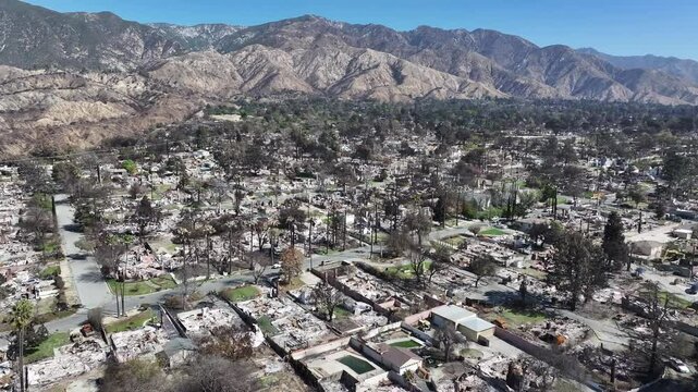 Aerial view of the L.A. fires burning and damaging homes in Altadena neighborhood in Los Angeles California