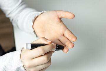 Measuring blood sugar levels with a finger prick test at home using a blood glucose monitor