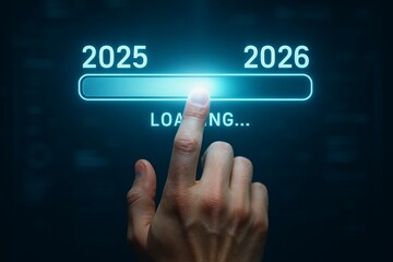 Hand touching digital progress bar from 2025 to 2026 with futuristic interface
