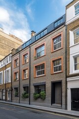 Obraz premium Modern brick building with large windows and greenery in an urban setting, located in a bustling neighborhood during a sunny day