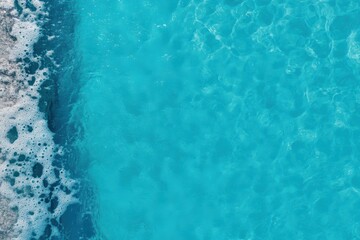 Fototapeta premium A person is lying on a surfboard floating in the water.
