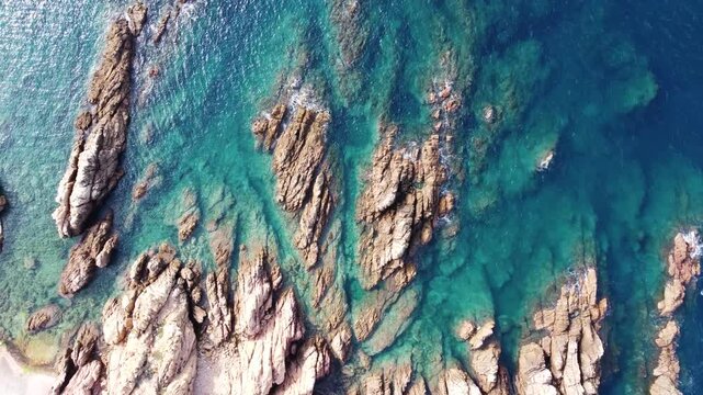 Top down, drone shot of the rock formation on Costa Paradiso in Sassari, Sardinia island, Italy