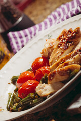 Healthy chicken fillet meal with cherry tomatoes and green beans – clean eating and low-fat diet concept for balanced nutrition