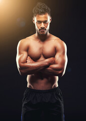 Fototapeta premium Fitness, portrait and man in studio with serious muscle, confidence and workout in health, wellness and power. Flexing, pride and strong bodybuilder on black background for exercise, body and care