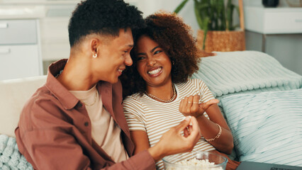 Happy couple, comedy or popcorn for laughing in home for romance, love and bonding together. Funny...