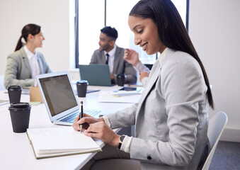 Happy, business woman and writing with book in meeting for collaboration, minutes or review at office. Female person, secretary or people taking notes for group discussion in teamwork at workplace