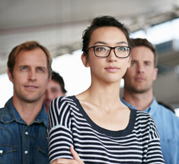 Fototapeta premium Serious, woman and group with confidence, business and project for men, creative and collaboration. Advertising agency, designer and employees for sales in company, proud and commitment for working