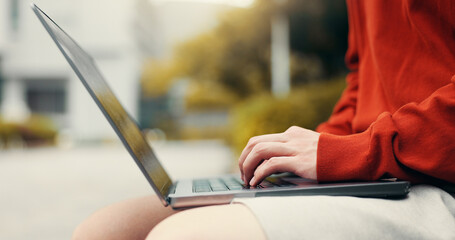 Man hands, laptop or typing in city for studying, planning or creative writing for travel blog in...