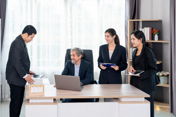 cheerful senior boss during business meeting,employees having conference in boardroom,conversation,consulting,discussing
