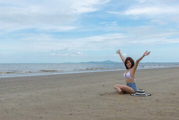 Asia happy Summer vacations Lifestyle woman relax and chill on beach background and Lifestyle and Travel Concept.