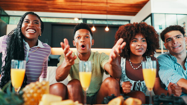 Friends, people and watching tv with surprise on sofa for match suspense, football team support and happy. Snacks, group and excited for live streaming game with tournament event and passion in home