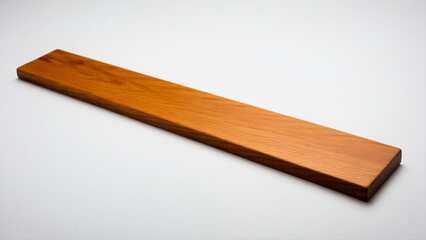 Simple Still Life: A Rectangular Plank of Finished Wood Exhibiting Warm Tones on a Plain White Surface