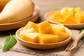 Cube mango on wooden plate ready to eating, Tropical fruit in summer season