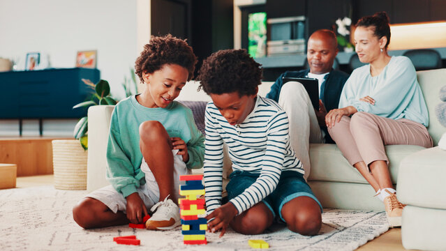 Building blocks, playing and kids on floor in home for development, growth or bonding. Happy, toys and boy children on carpet in living room for connection, friendship or siblings together in house. - Powered by Adobe