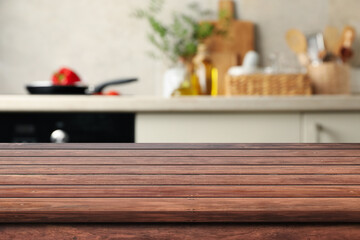 Empty wooden table front kitchen, blurred background, orange tone morning or evening, warm mood. Modern minimal style wood counter, decorated textured patterns, display food ,home decoration products.