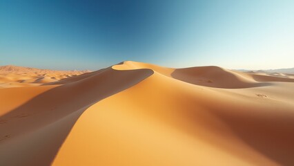 Endless golden sand dunes under clear blue sky in remote desert landscape	