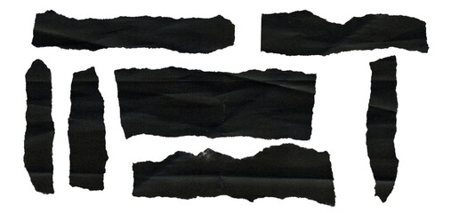 Dark, moody texture of ripped black paper pieces.