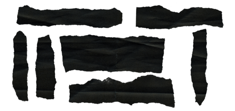 Dark, moody texture of ripped black paper pieces.