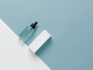 Cosmetics and waves on a blue background