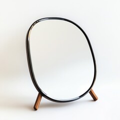 Fototapeta premium Modern, oval-shaped mirror with wooden legs. Features a smooth, organic design