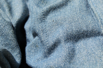 Blue denim fabric material close-up abstract textured background