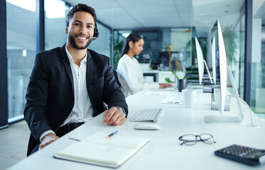 Man, happy and portrait in call center with computer in office, consult and help desk for customer support. Telemarketing, csr and worker with sales consultant, phone operator and helpline in Germany