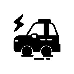 A black car with a lightning bolt on it. The car is parked on a road