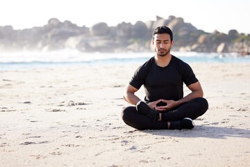 Yoga, meditation and man with peace on beach for spiritual mindfulness or self care for healthy...