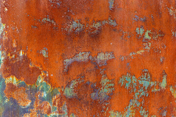Rusty metal with peeling green paint leftovers