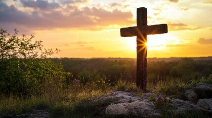 A cross on a hill with flowers, presented on a nature background.