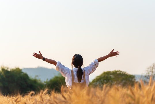 happy young man jumping in the field
