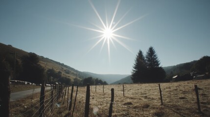 Fototapeta premium Sunny Mountain Landscape Serene Pastoral Scene with Fence