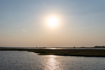 Midday sun high in the sky over the banks of the chobe river in botswana africa 