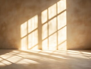 Sunlight streaming through windows casts rectangular shadows on a beige wall and floor