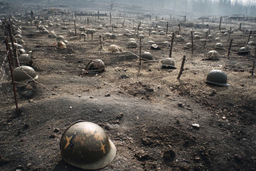 Somber Battlefield Image with Abandoned Helmets Barbed Wire and Muddy Ground