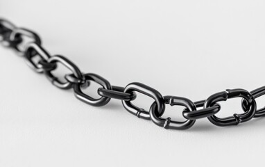 Obraz premium Broken Black Metal Chain on White Background