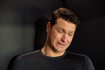 Fototapeta premium Studio shot of sad man felling sorry for something.