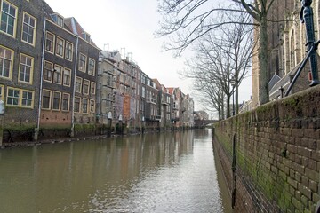 Obraz premium Dordrecht Netherlands - 27 January 2024 - Old warehouses at the Pottenkade next to the Grote Kerk in Dordrecht in the Netherlands