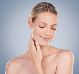 Antiaging, skincare and calm woman with beauty and healthy texture on studio background. Clean, face and model smile with glow on skin from dermatology facial, cosmetics and self care treatment