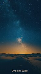 Fototapeta premium A breathtaking night sky view of the milky way over a vast desert landscape.