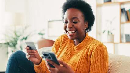 Home, credit card and black woman with smartphone, excited and online payment with smile. App,...