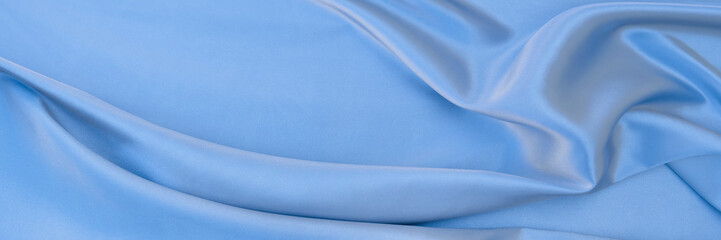 sky blue satin texture that is gray silver fabric silk background with beautiful soft white  pattern natural.