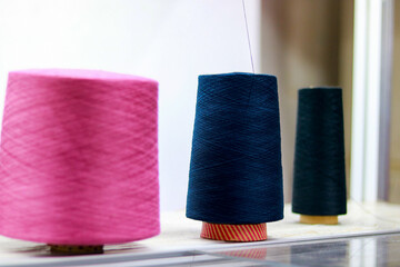 Spools of thread for sewing and embroidery on the table